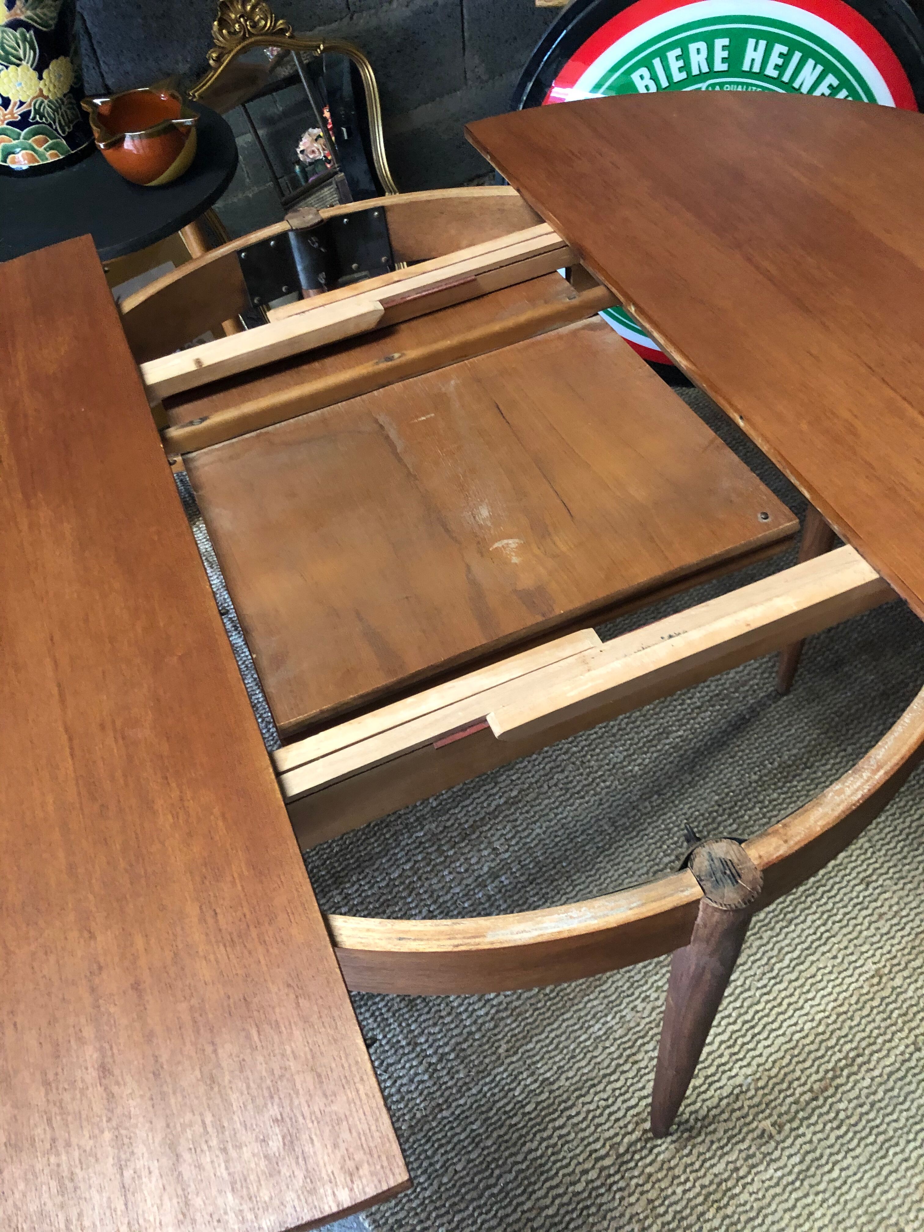 Teak round table with built-in extension
