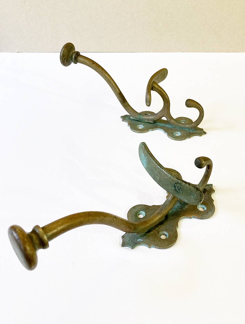 Antique patinated brass coat hooks