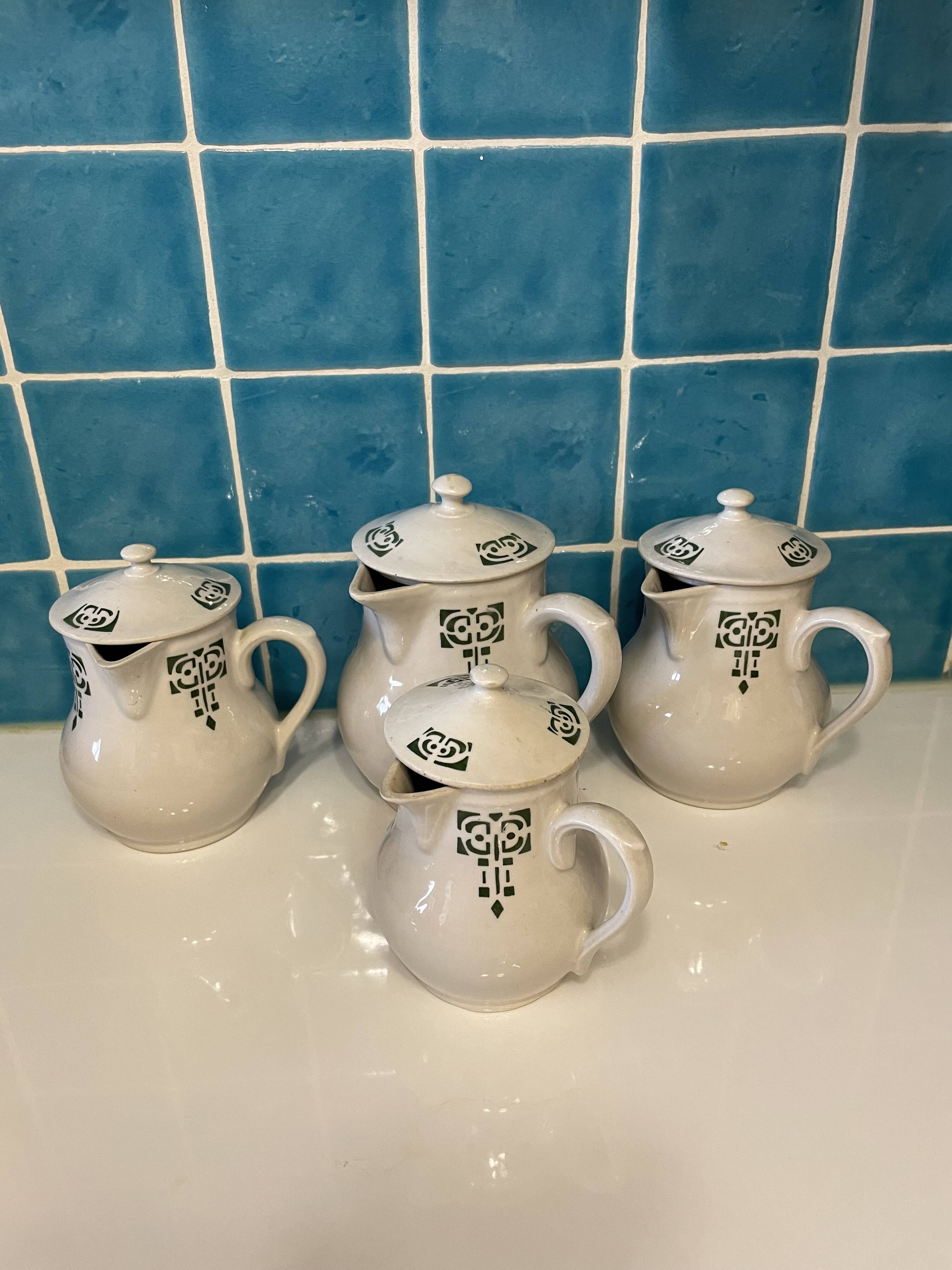 Set of 4 vintage art deco Saint Uze pitchers