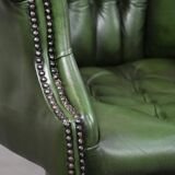Large green cowhide Chesterfield office chair in English style on wheels
