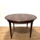 Extendable dining table in Rio rosewood.