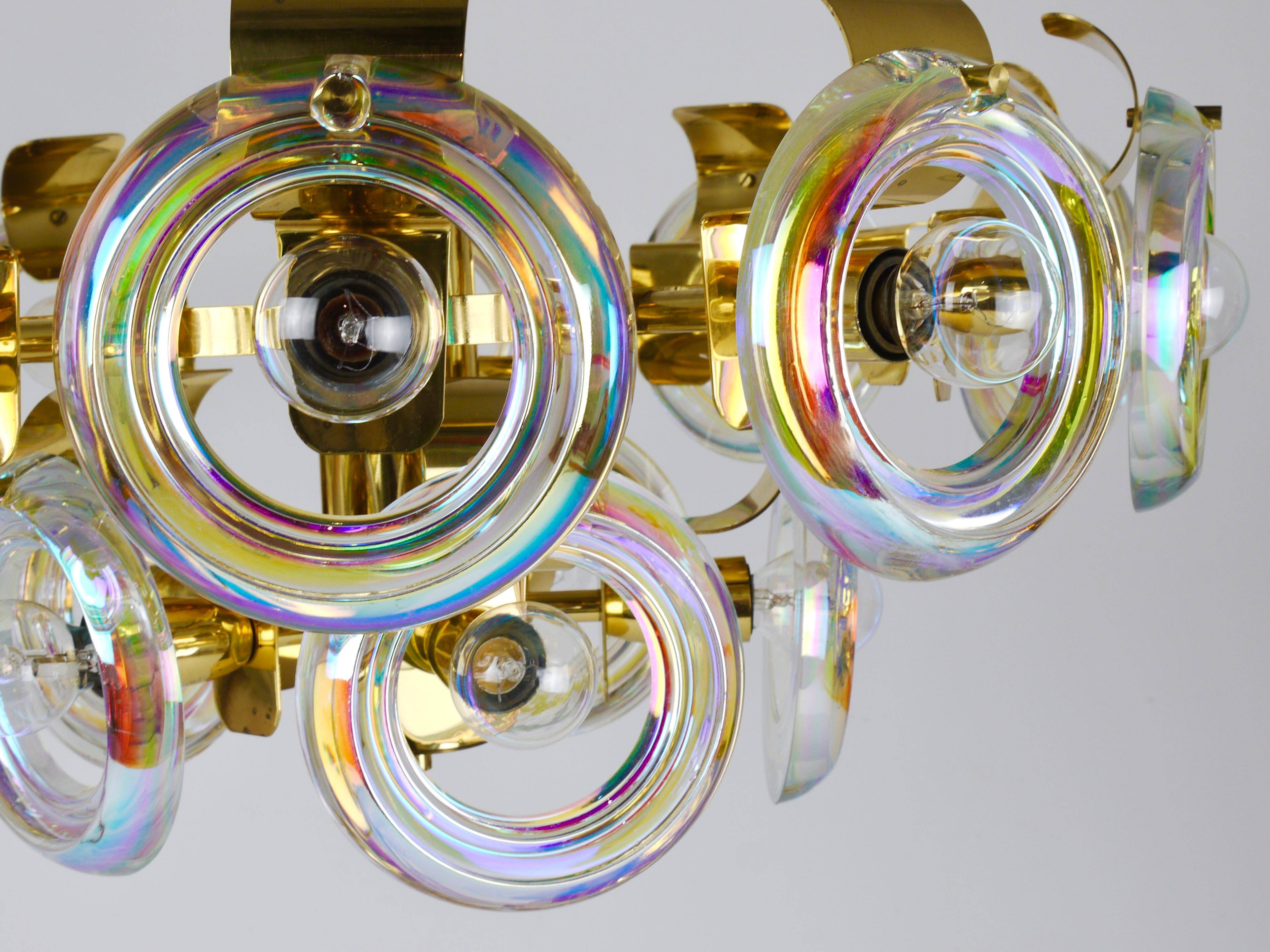Large brass chandelier by Oscar Torlasco, rainbow optical glass rings, Italy, 1970s.