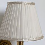 Pair of gilded bronze and plexiglass wall lights