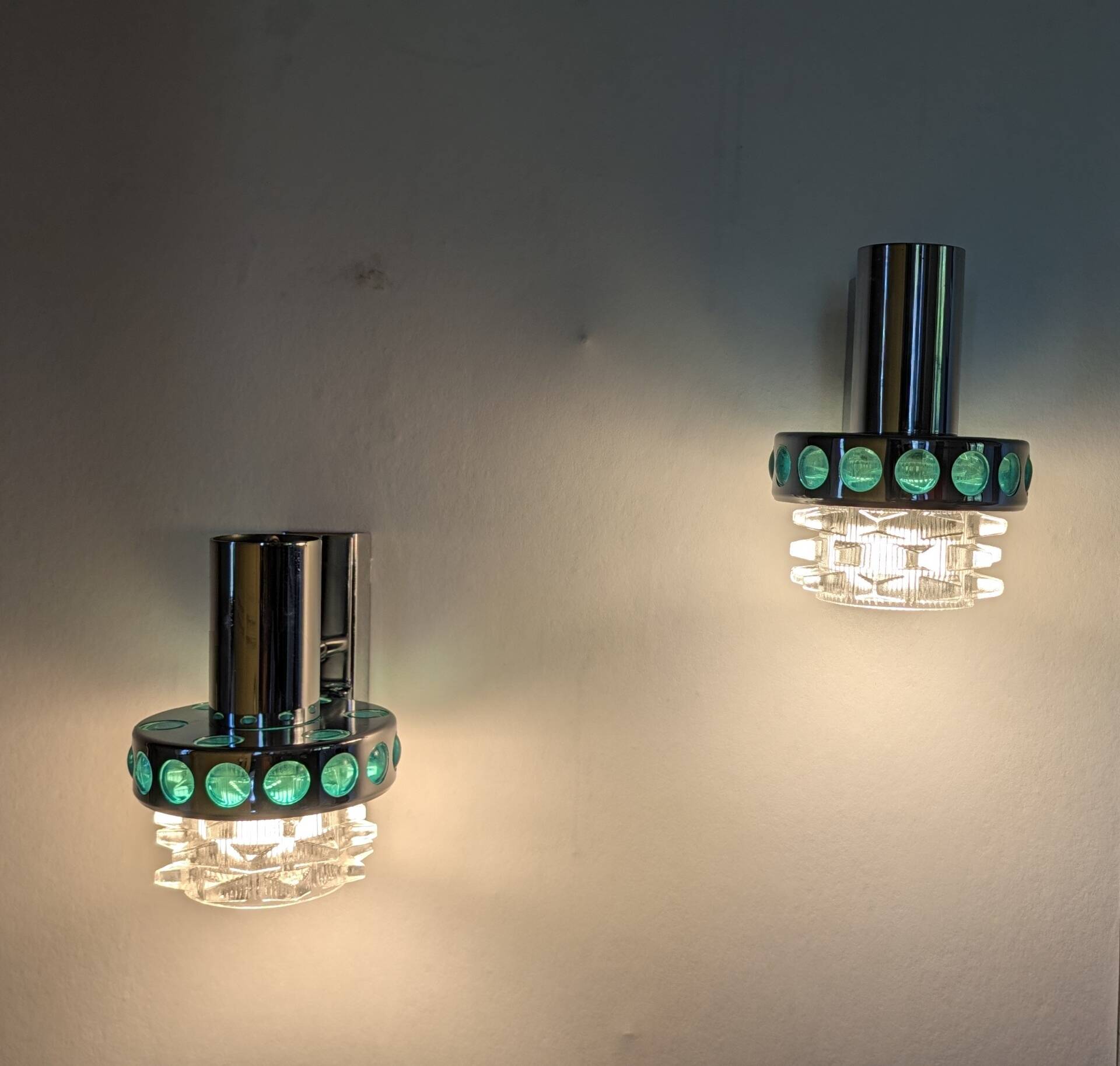 Pair of Space Age wall lights in chrome and green glass, 1970s.