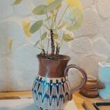 Pitcher with ethnic decorations