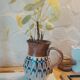 Pitcher with ethnic decorations