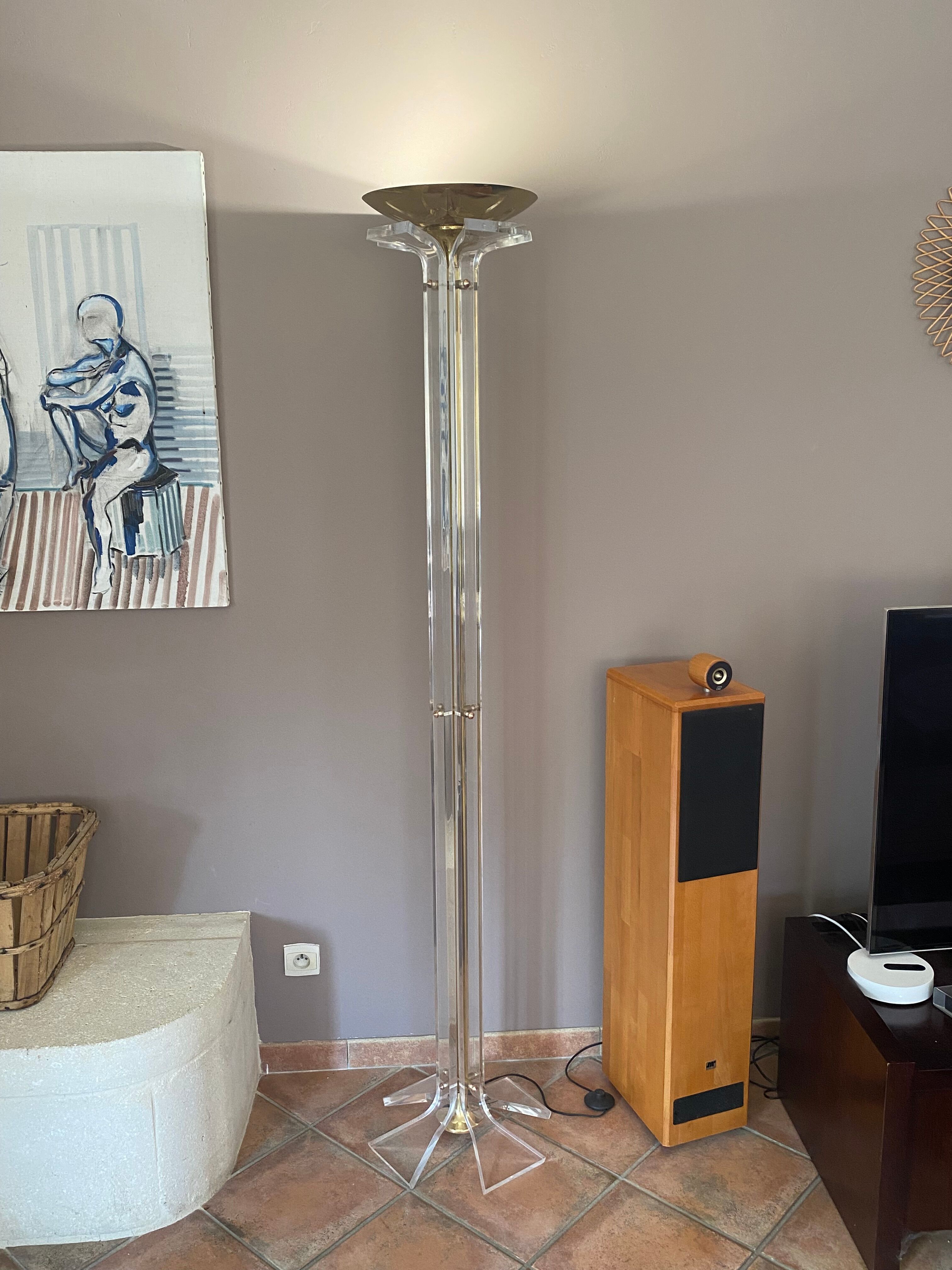 Plexiglass and brass floor lamp. 1970. Italy.