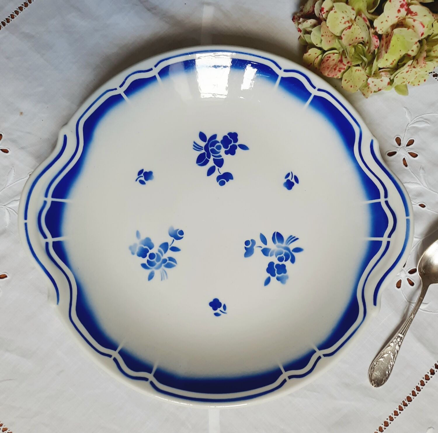 Mismatched old dessert plates accompanied by a dish