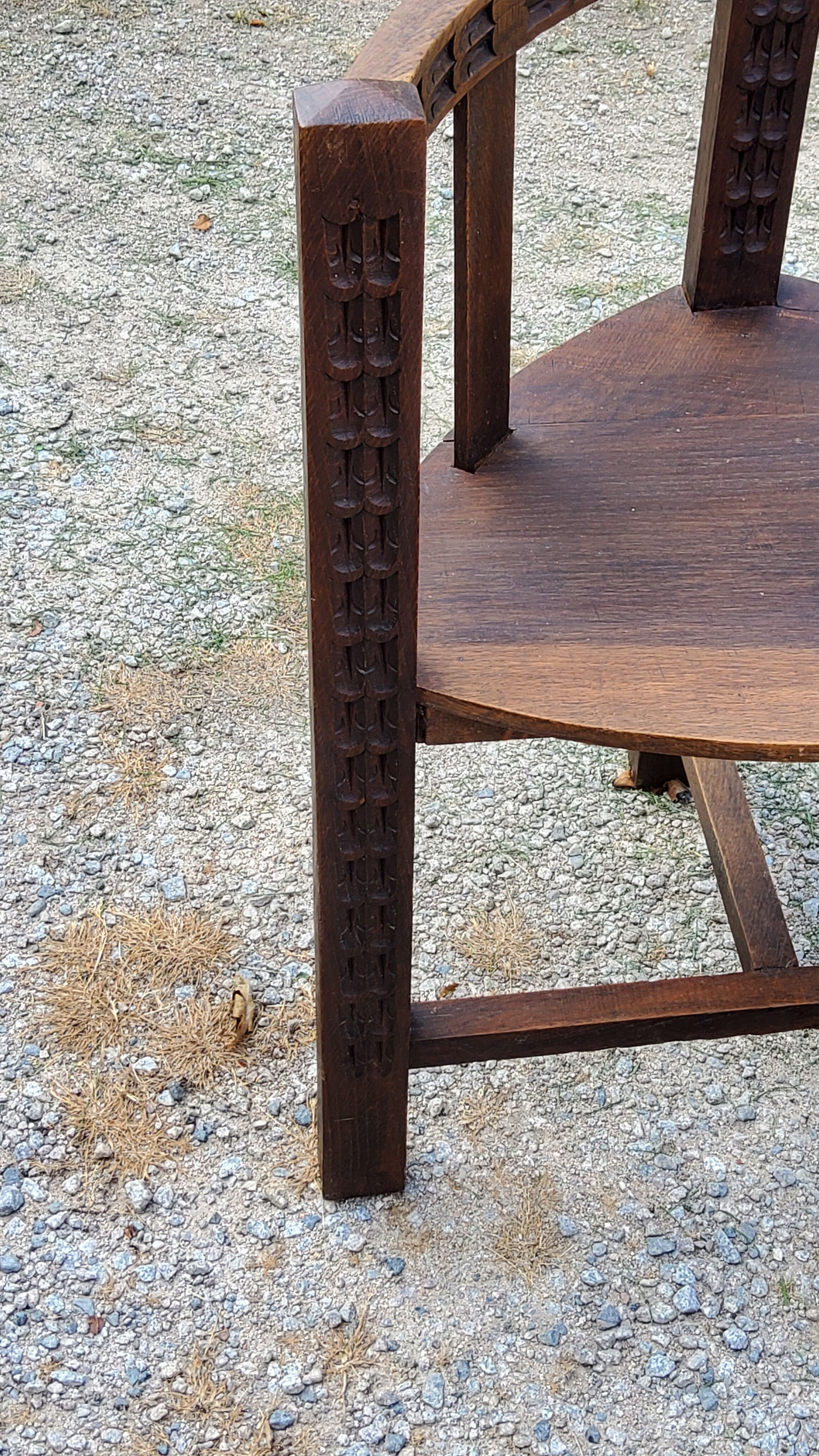 Set of three brutalist tripod armchairs in carved solid oak