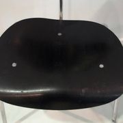 Set of four Egon Eiermann model SE 68 chairs in black lacquered plywood and steel.