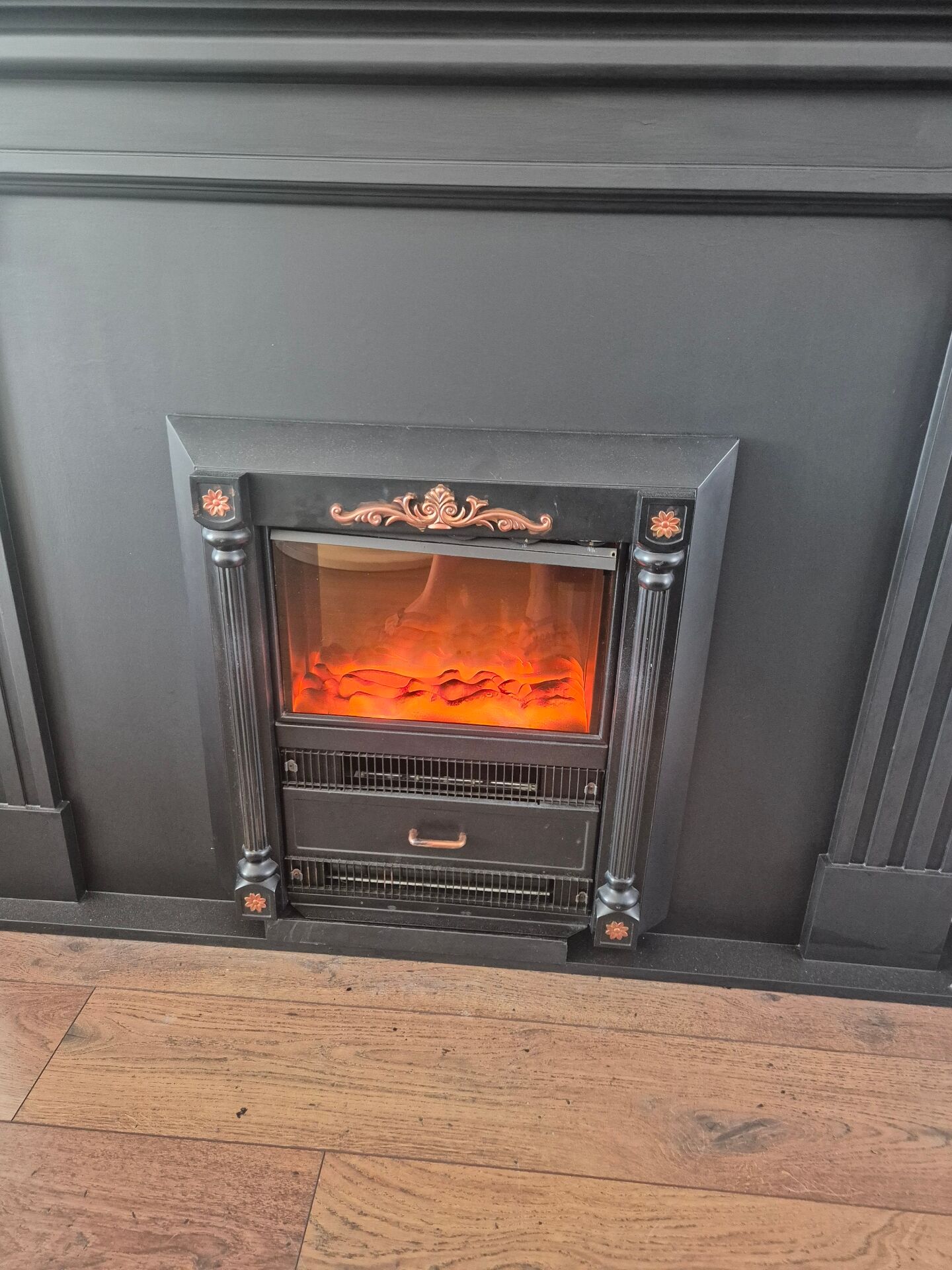 Luxury electric fireplace and classic black mantel suite