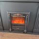 Luxury electric fireplace and classic black mantel suite