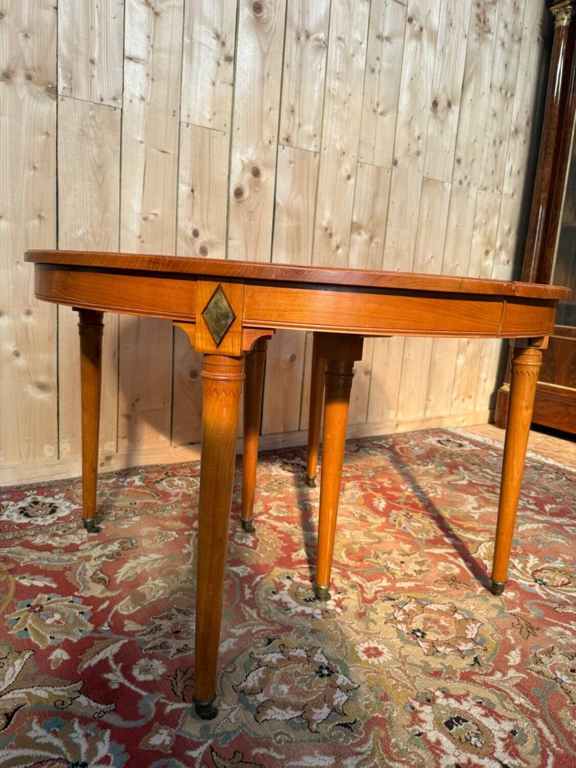 Louis XVI style dining table in cherry wood with extension.