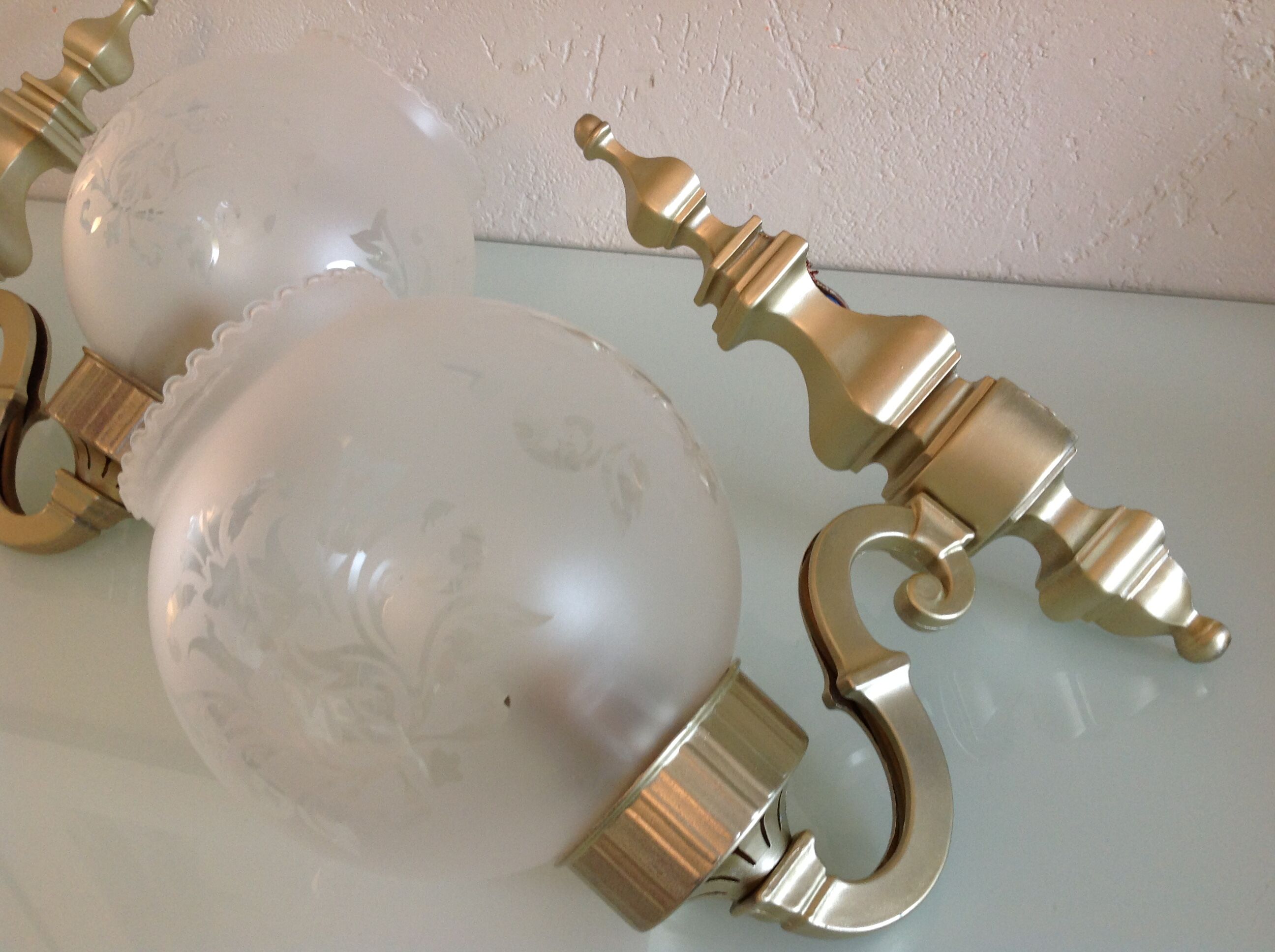Pair of wall lamps in gilded metal and frosted glass art deco style