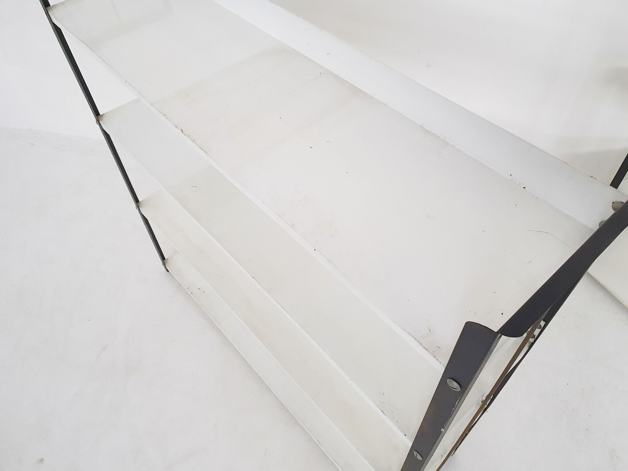 Set of two black and white metal book shelves attrb. to Tomado, Holland, 1950's