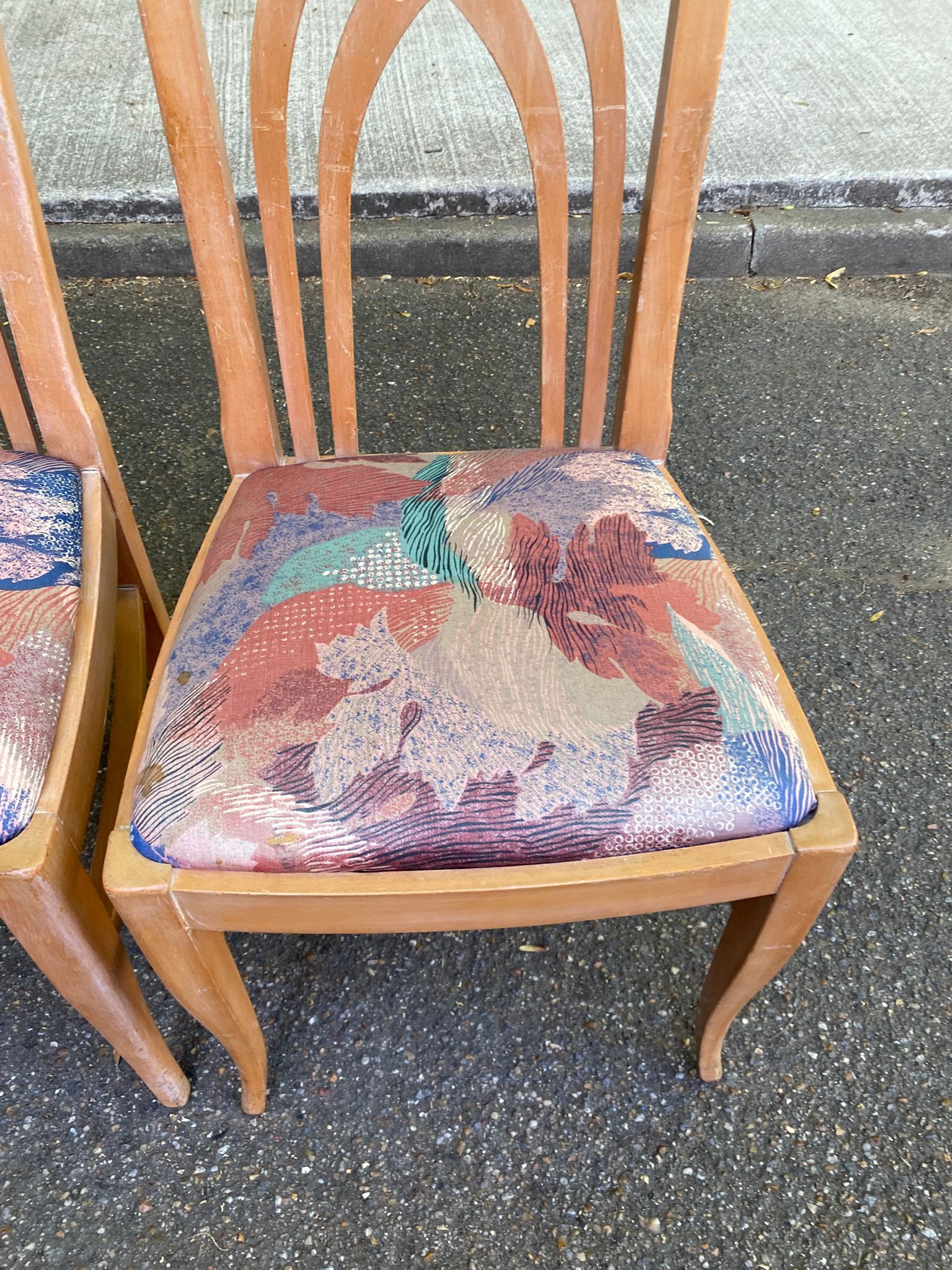2 dining or kitchen chairs with high backs and fabric.