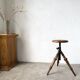 Tripod workshop stool in turned wood and cast iron — circa 1900