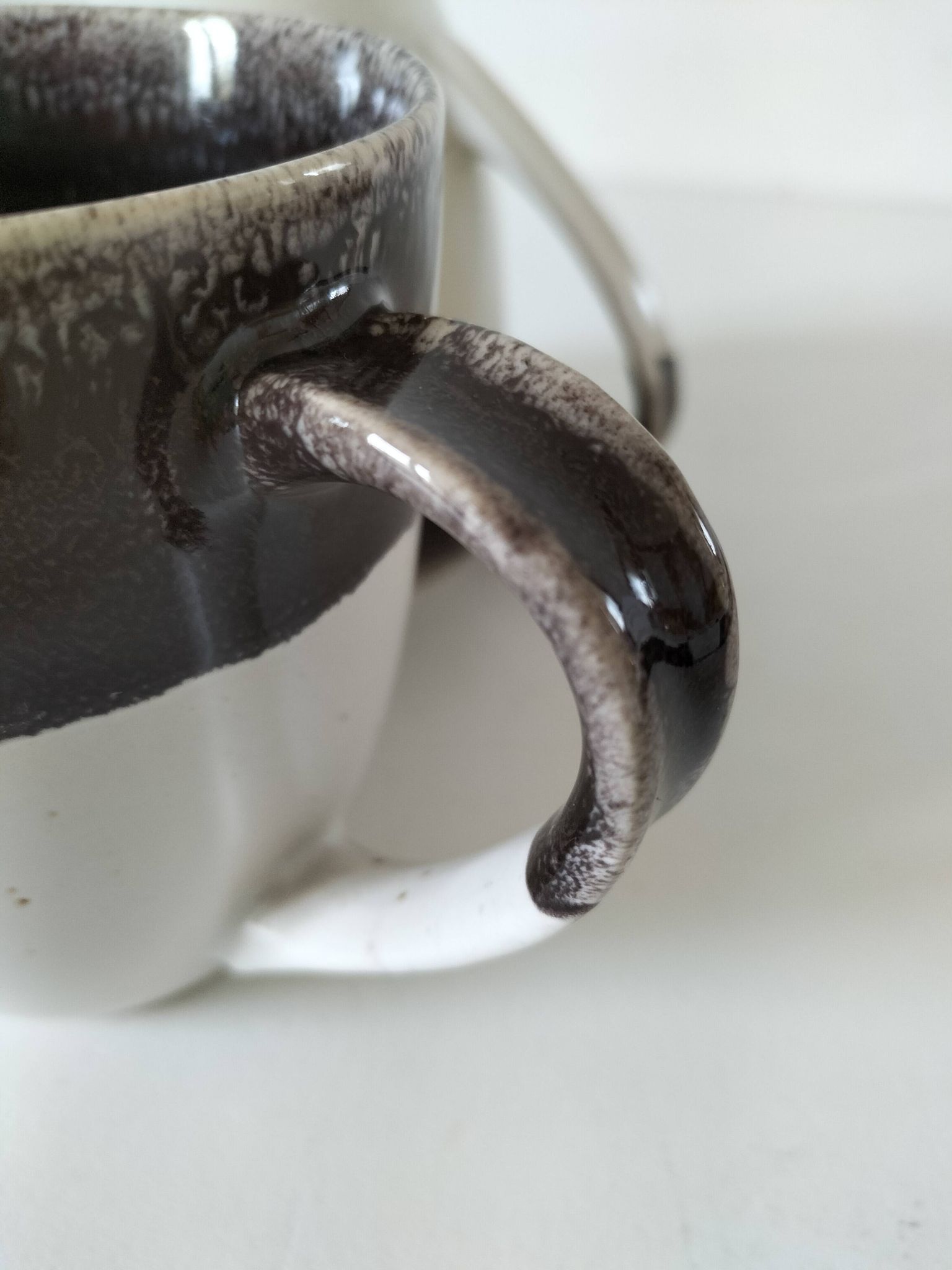 Set of three two-tone mugs, glazed stoneware, café workshop style.