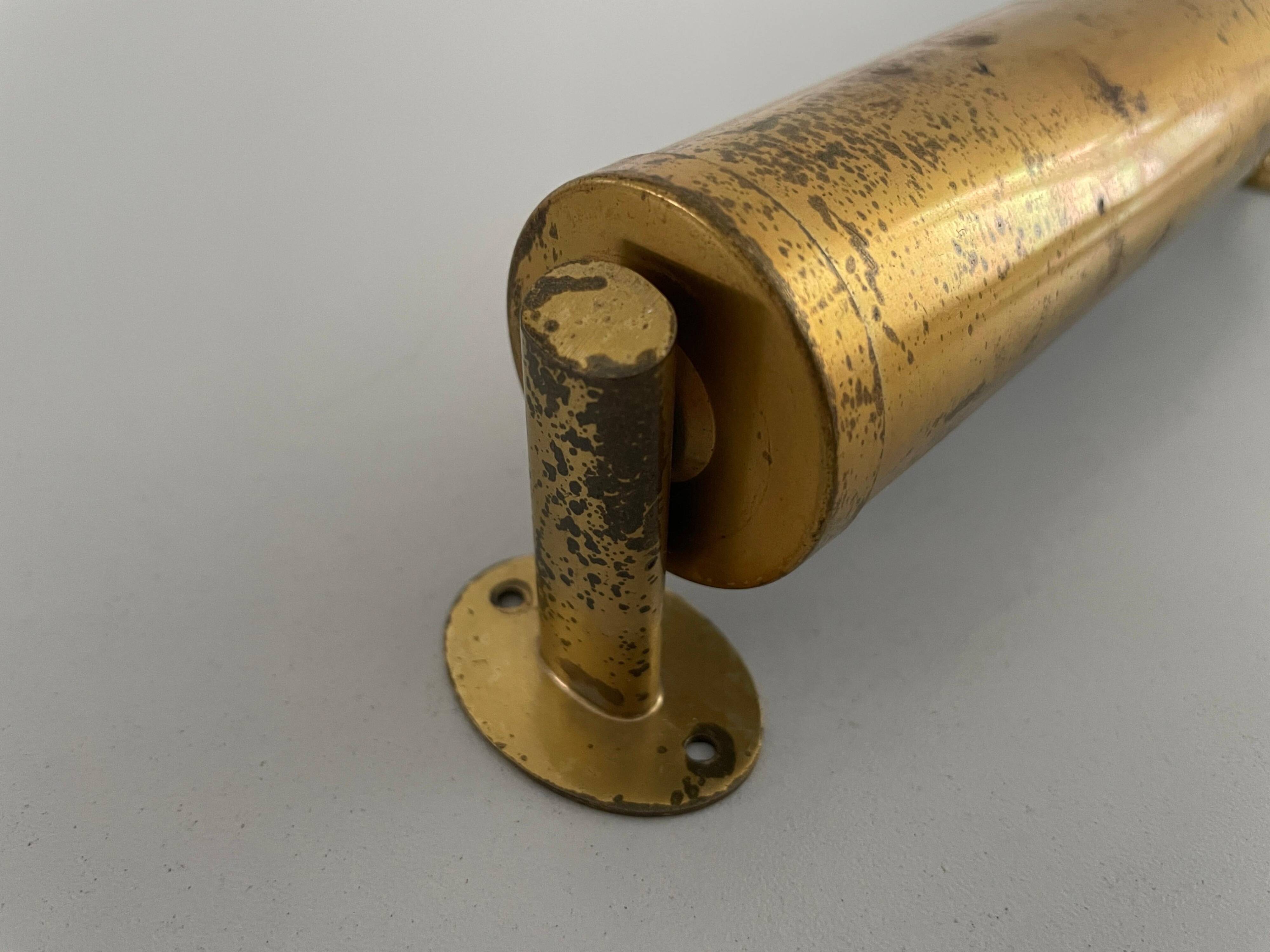 Small simple cylindrical brass wall light from the mid-century, 1950s, Germany.
