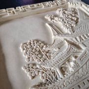 Sculpted resin plaque in the style of China.