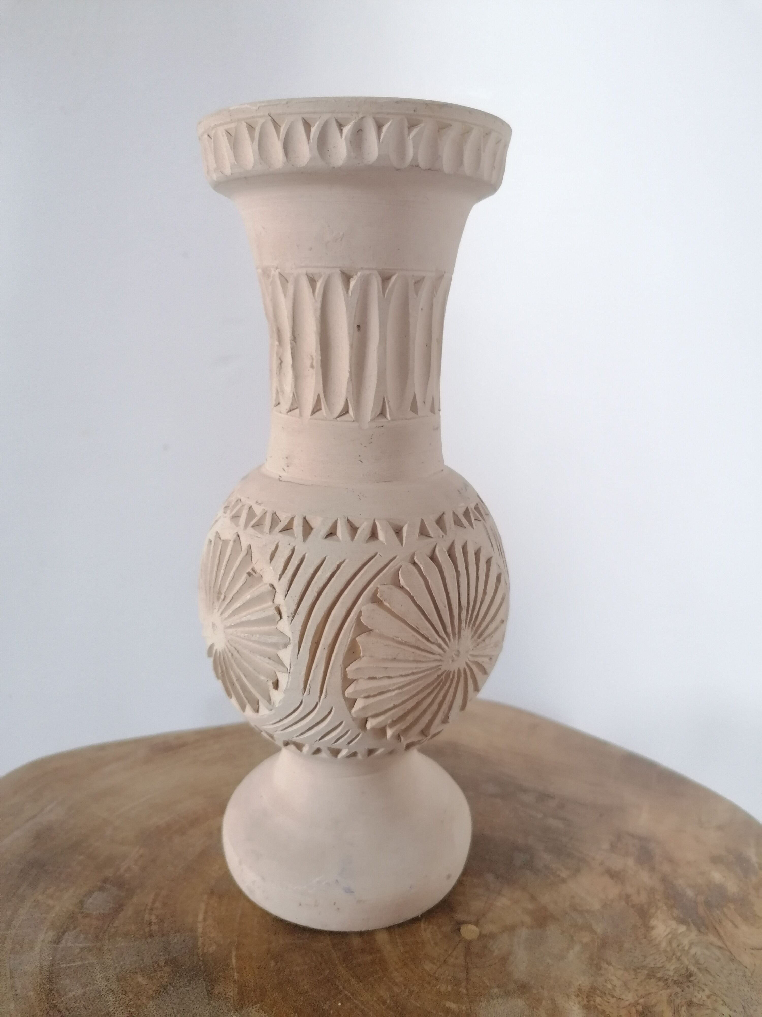 Clear natural terracotta vase decorated ethnic motifs