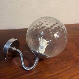 Delmas chrome wall light with chiseled glass globe