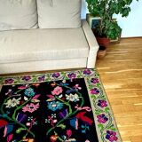 Romanian wool carpet floral design with green border on black background 180x153cm