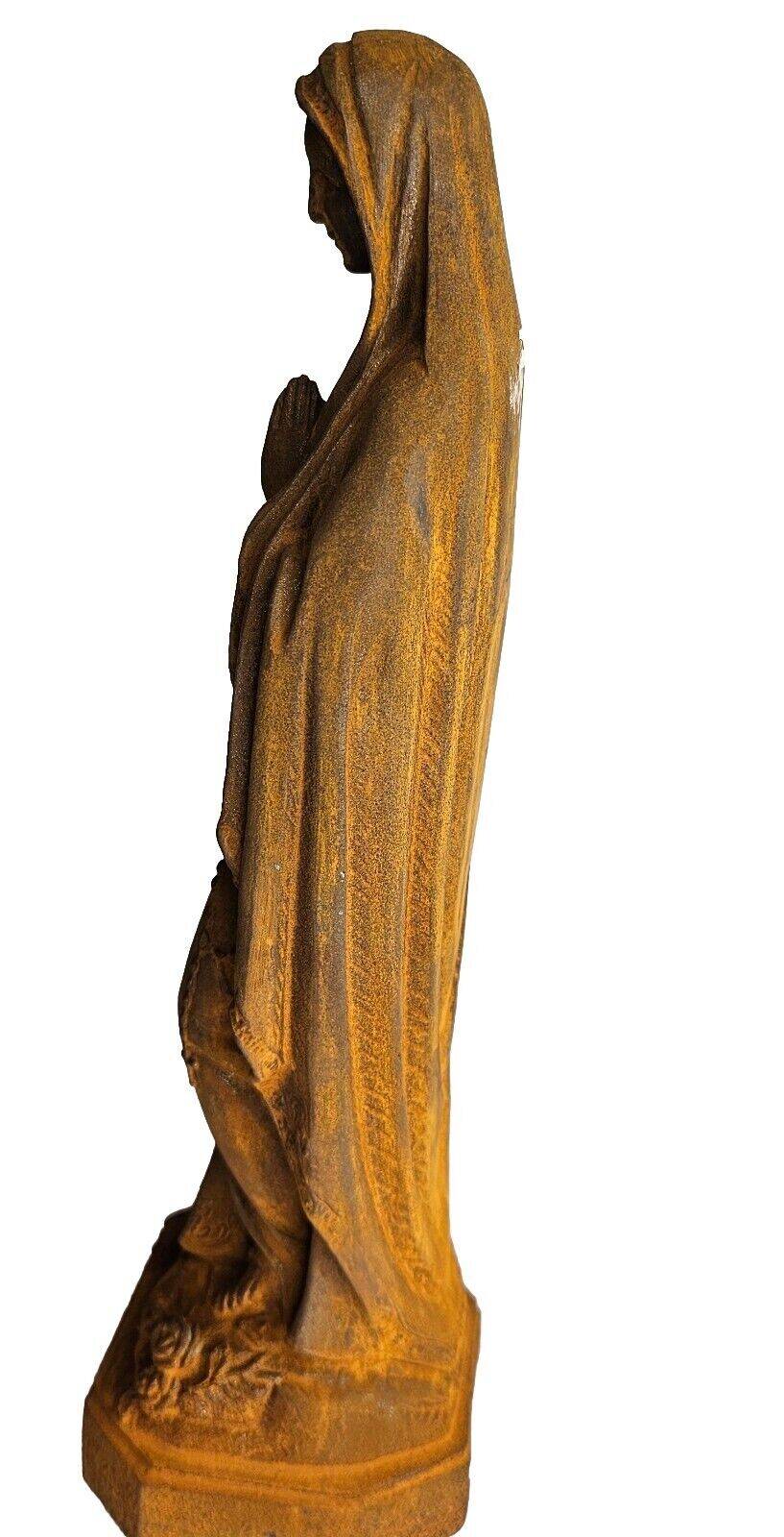 cast iron statue of the virgin