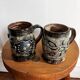 Vintage terracotta mugs with glazed designs and flower/fish motifs