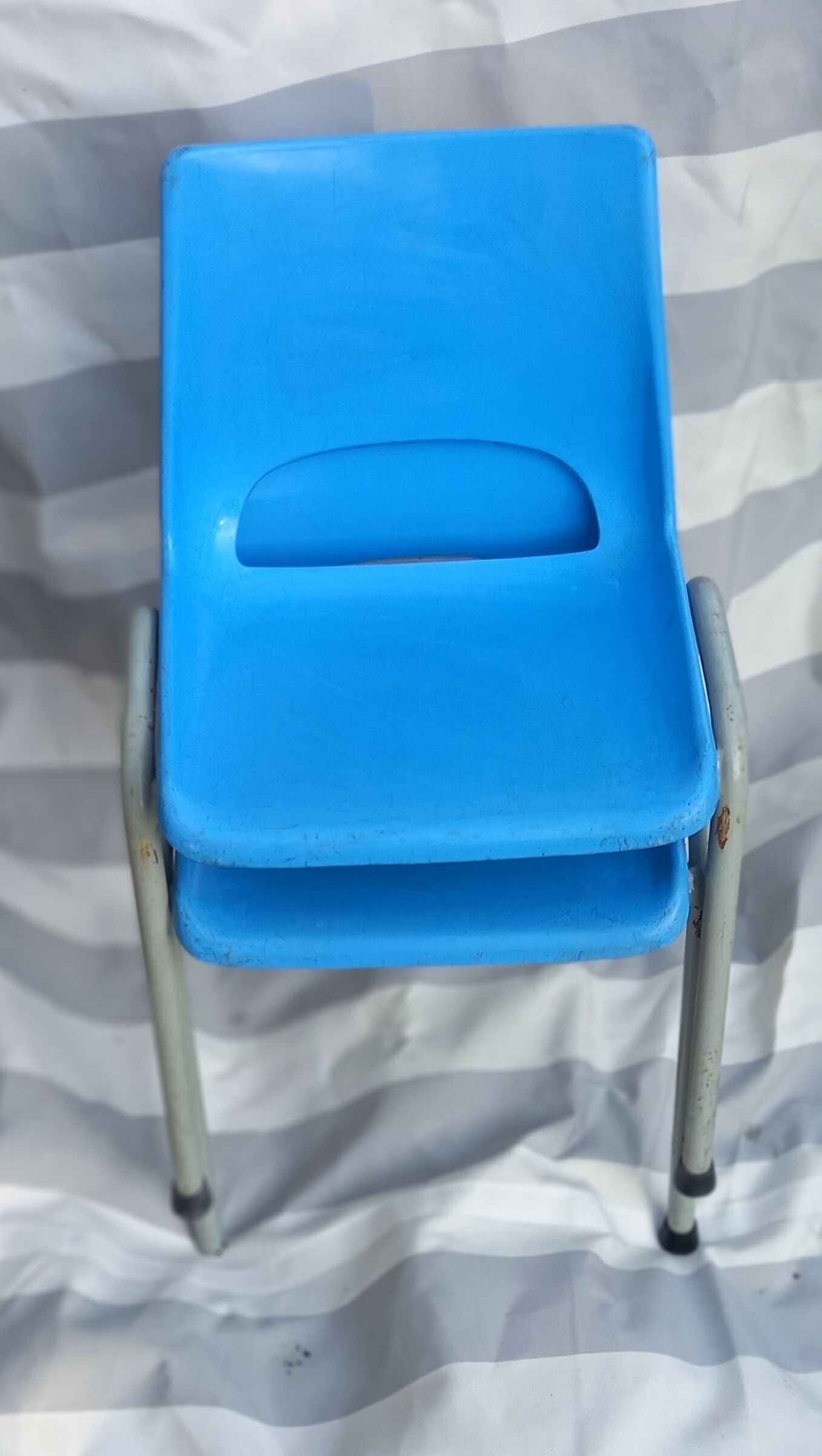 Pair of tubular metal child chains and plastic seat