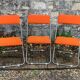 Framar orange felt folding chairs 1970