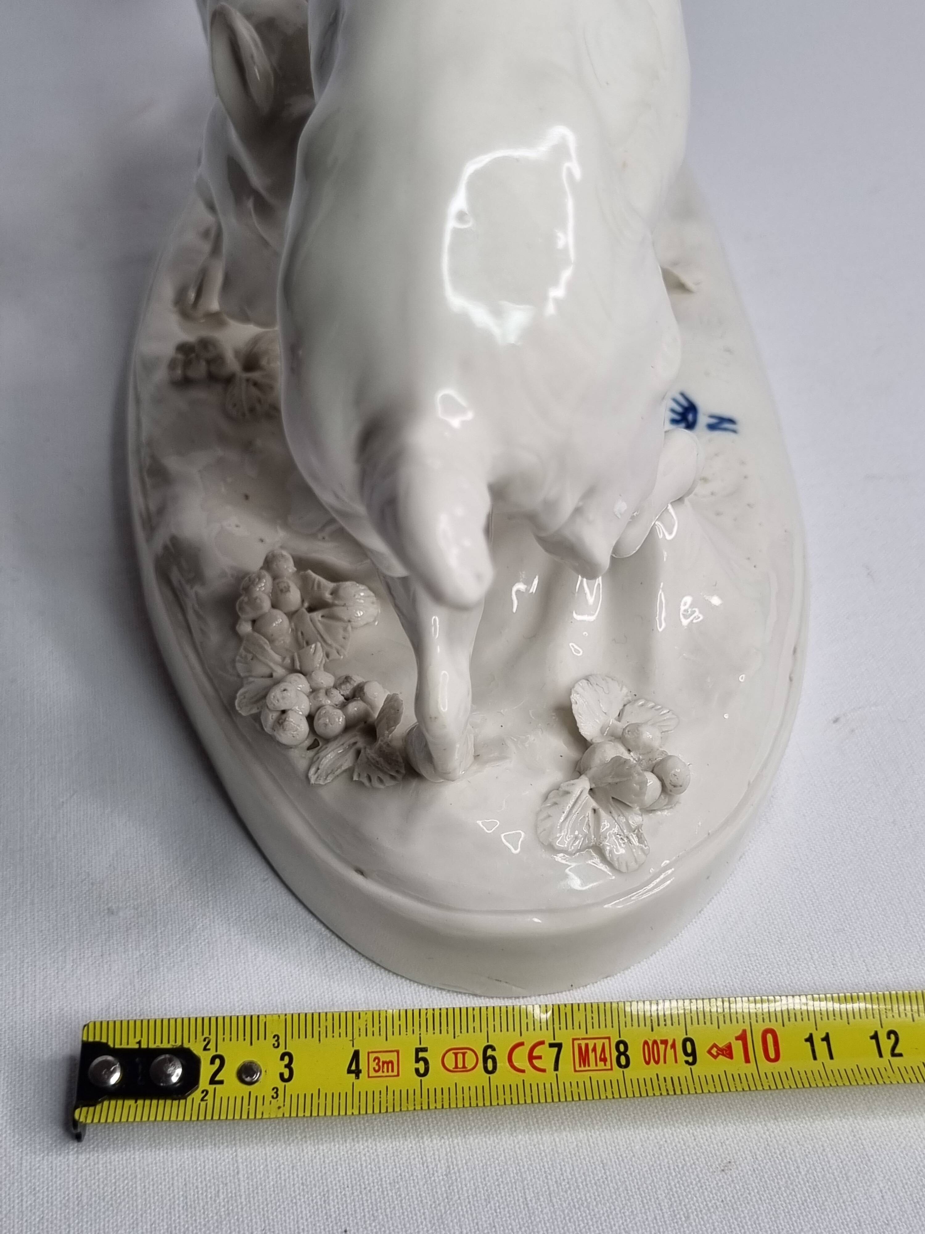 Saxon porcelain group, two fighting goats, signed Röhle, 1900