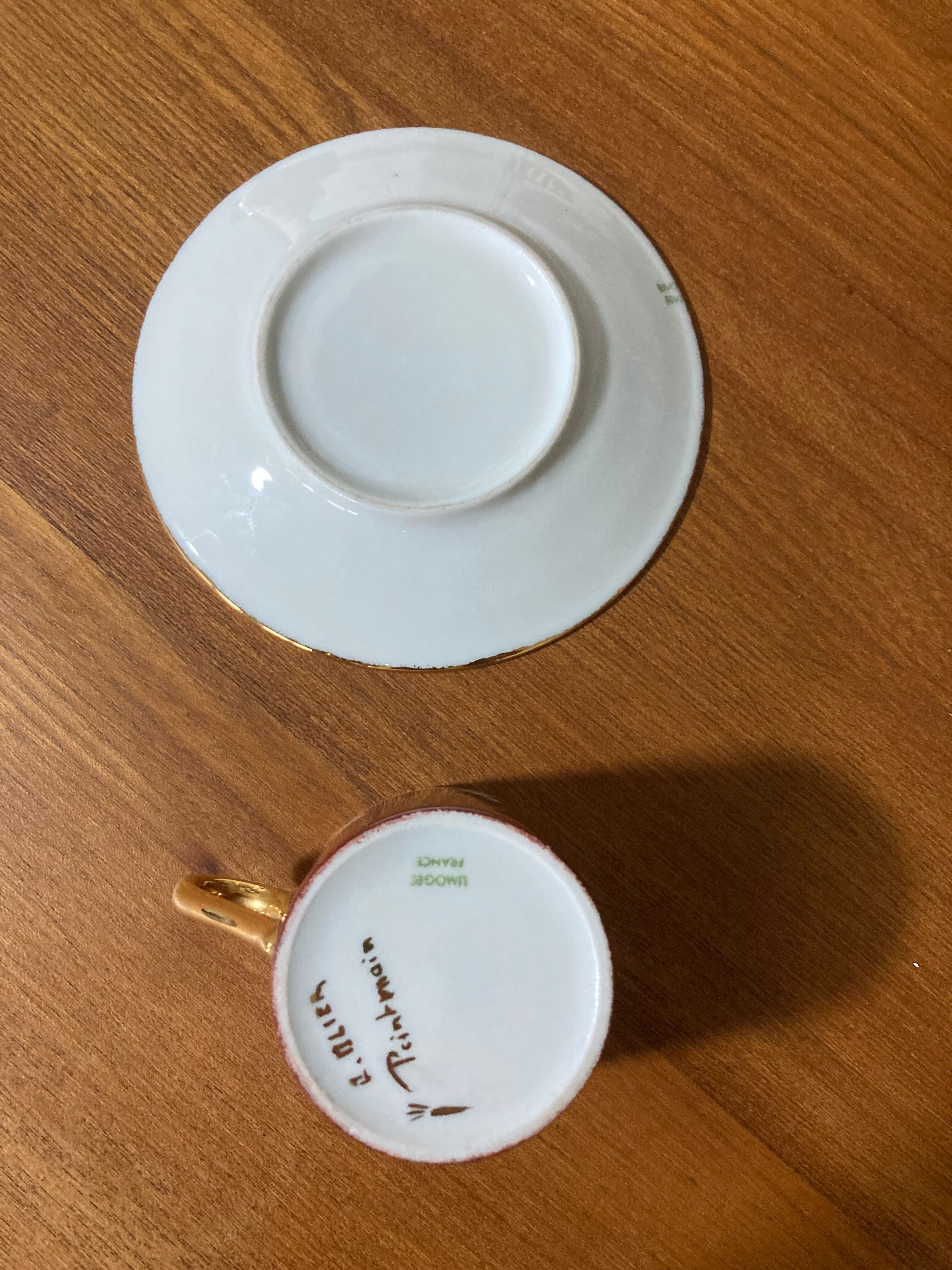 Hand-painted Limoges porcelain cup and saucer signed R. Blier