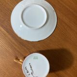 Hand-painted Limoges porcelain cup and saucer signed R. Blier
