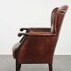 Classic vintage wingback chair in sheepskin and wood