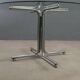 Vintage round table in chrome metal and glass, 1970s.