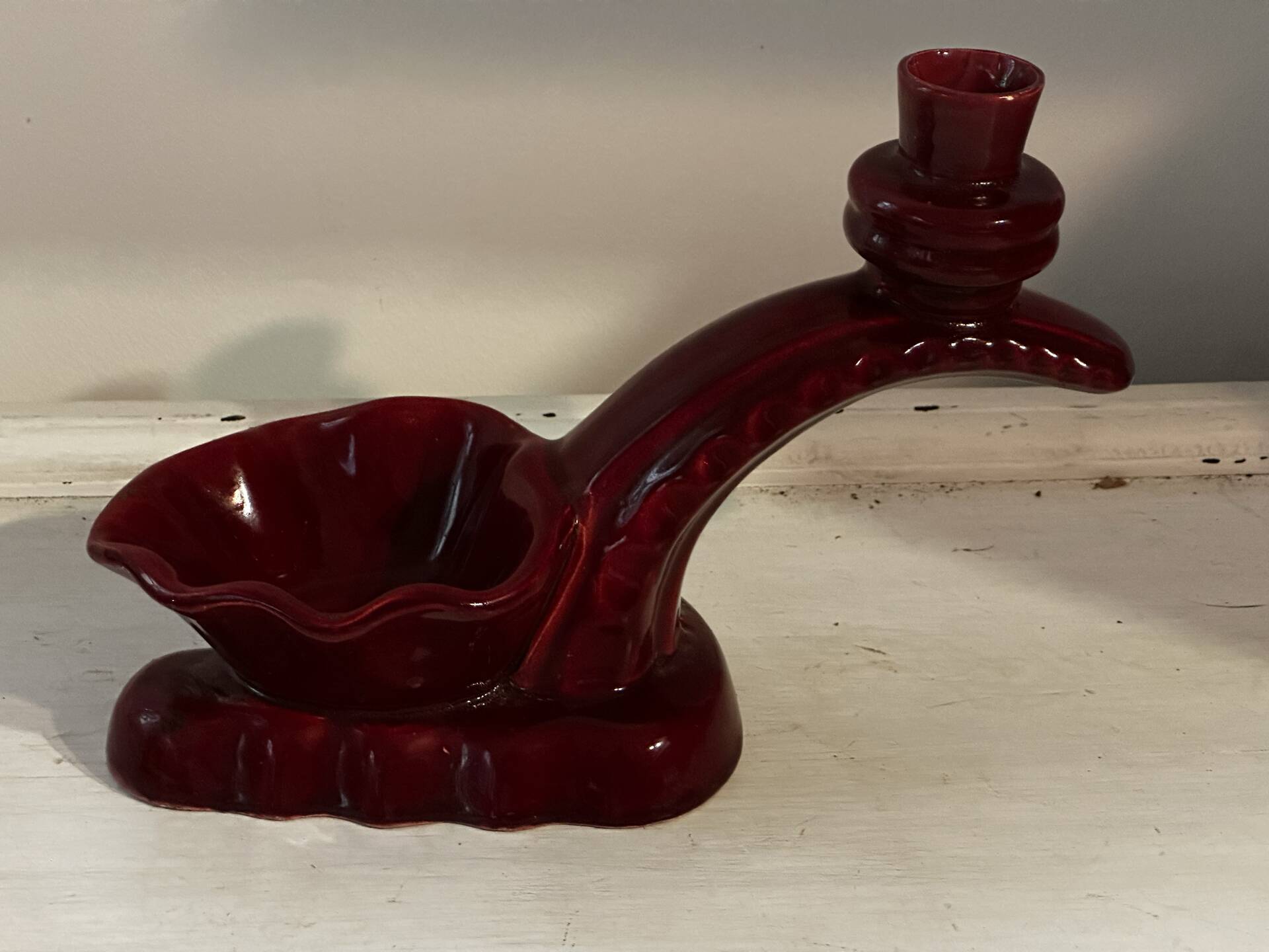 Ruby red ceramic pocket ashtray from Vallauris, numbered.