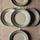 A set of 5 mismatched green blue Terre de fer flat plates