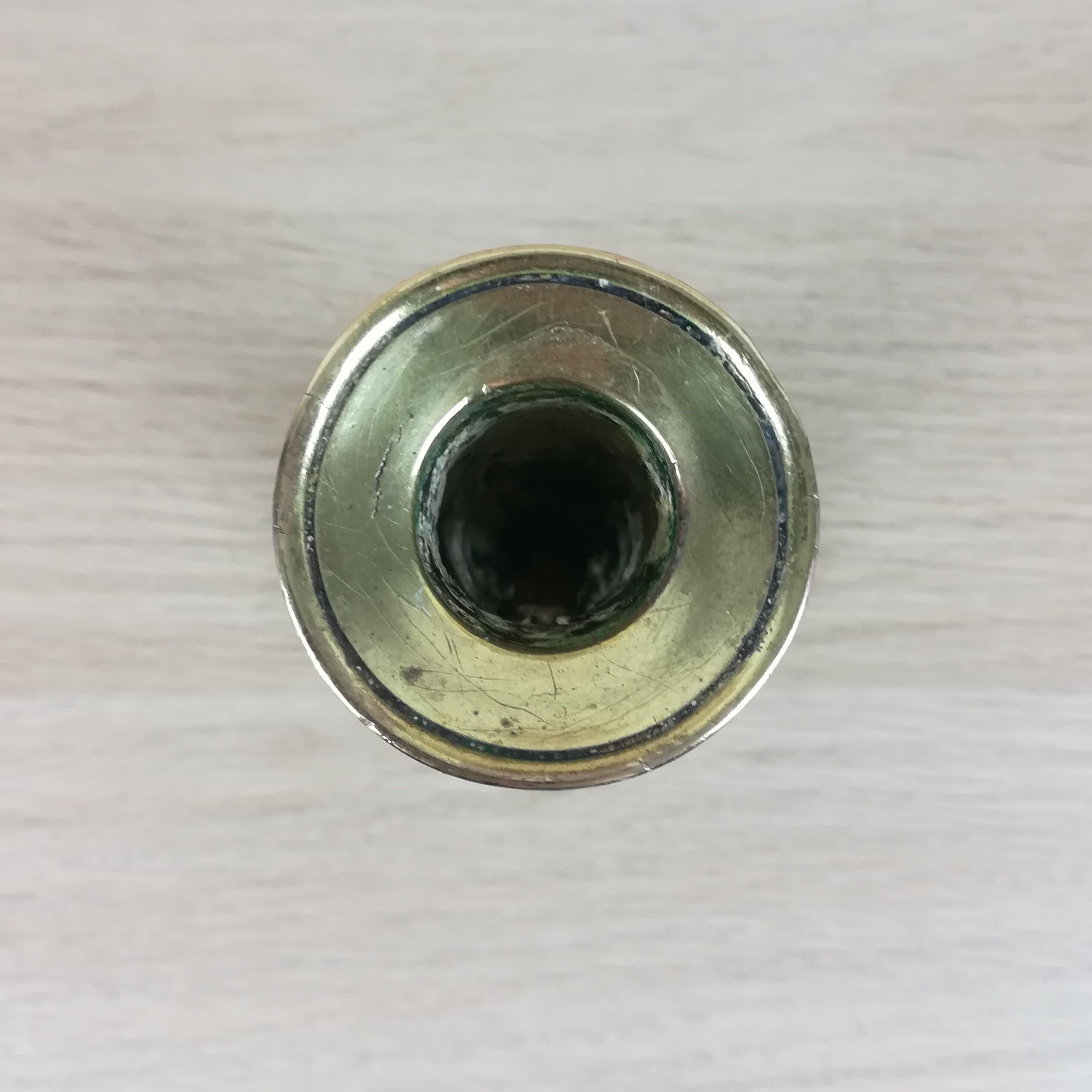 Brass pusher candle holder