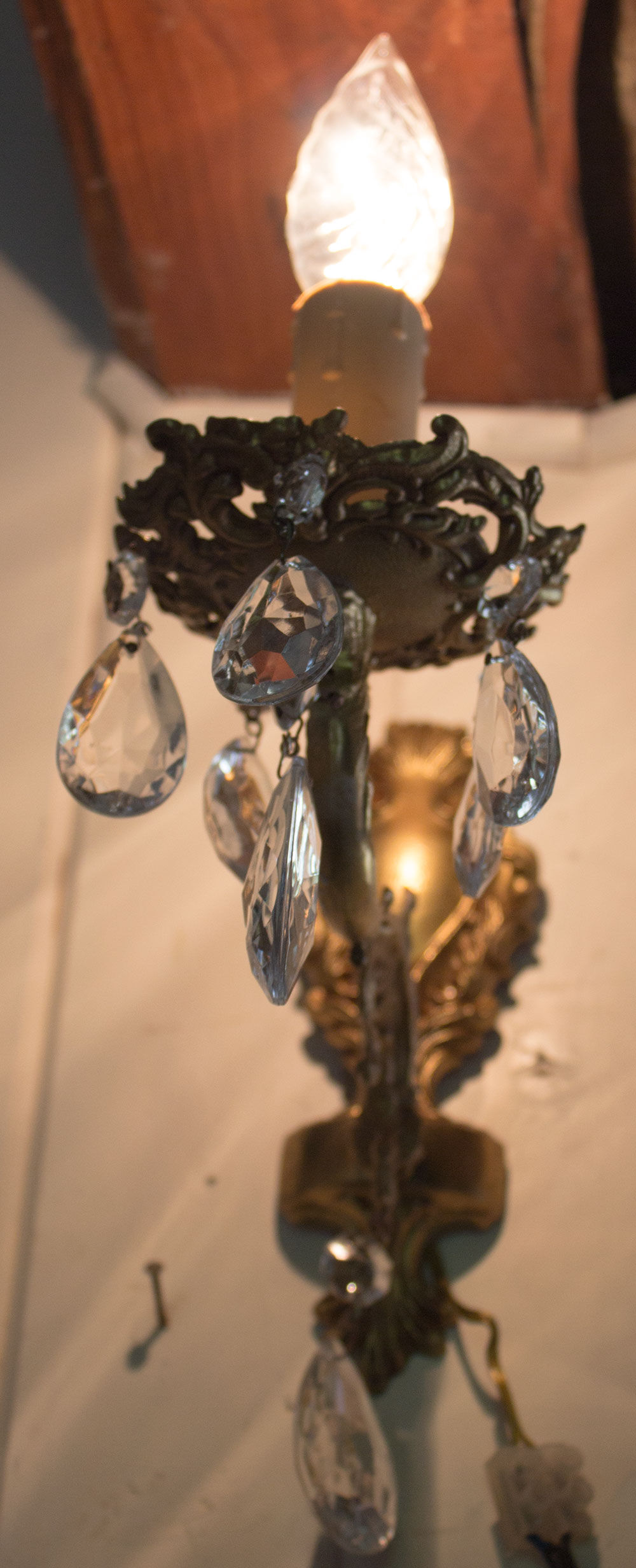 Old brass wall light with glass stamps