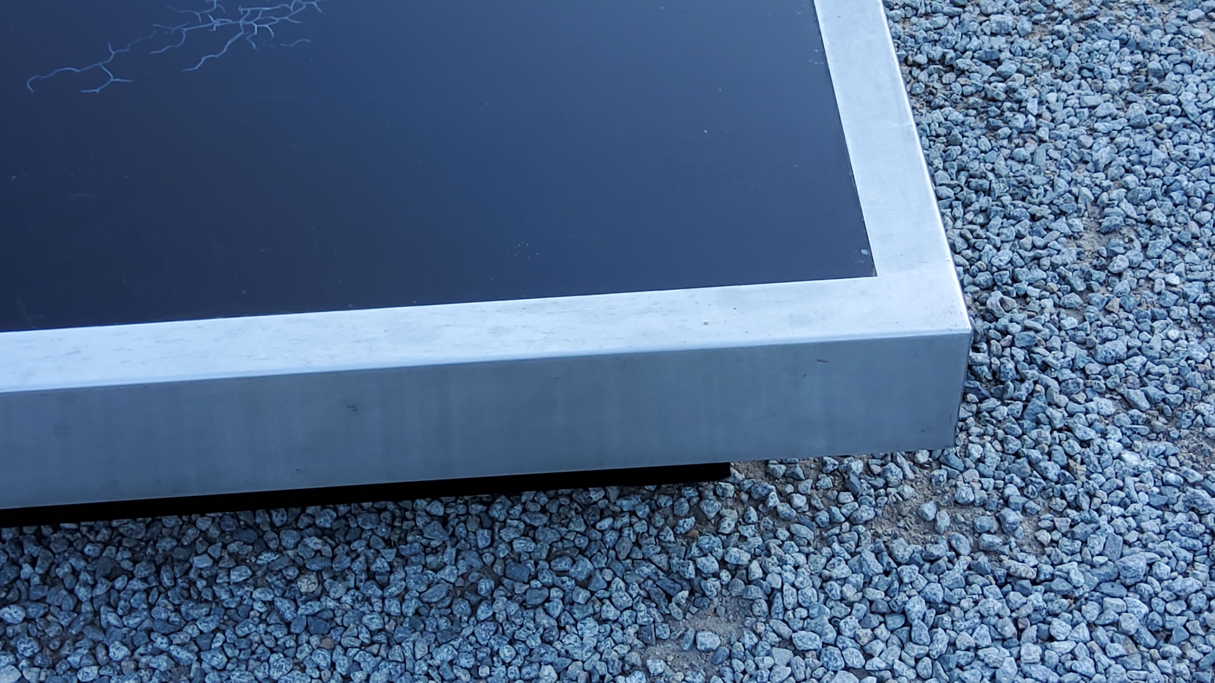 Coffee table in brushed steel and black tinted glass from the 70s