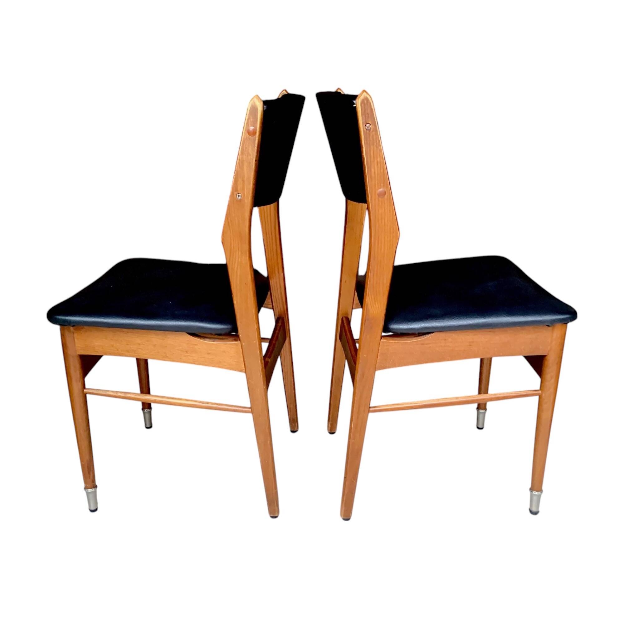 Pair of Scandinavian chairs in wood and black skai