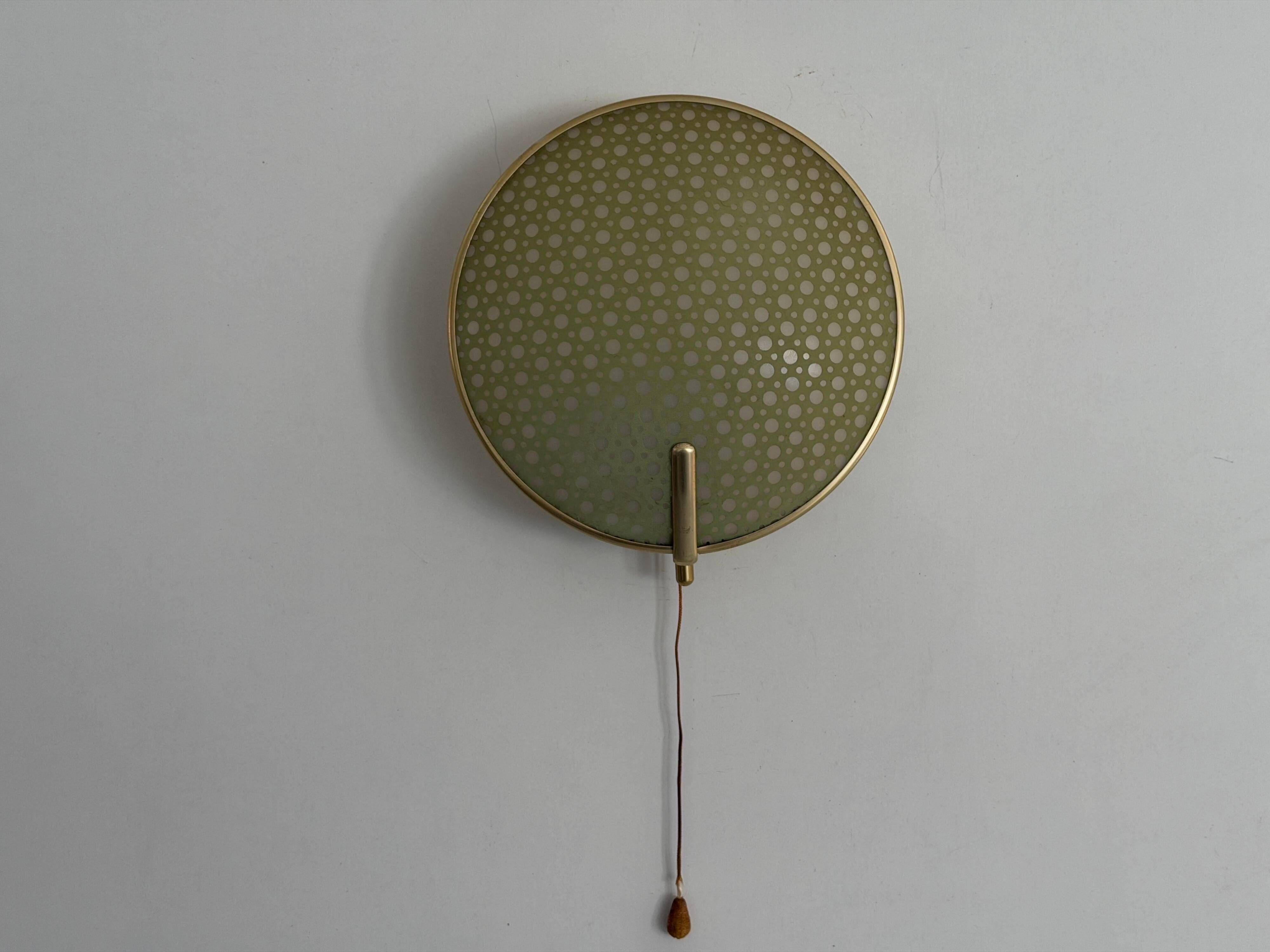 Pair of green plexiglass and gold metal wall lights by Erco, 1950s, Germany.