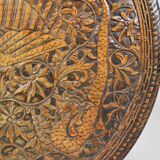 Asian coffee table carved with dragons and peacocks, Indonesia, early 20th century