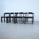 Set of eight black lacquered dining chairs
