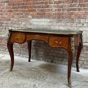 Antique French-style desk with green leather top and bronze mounts