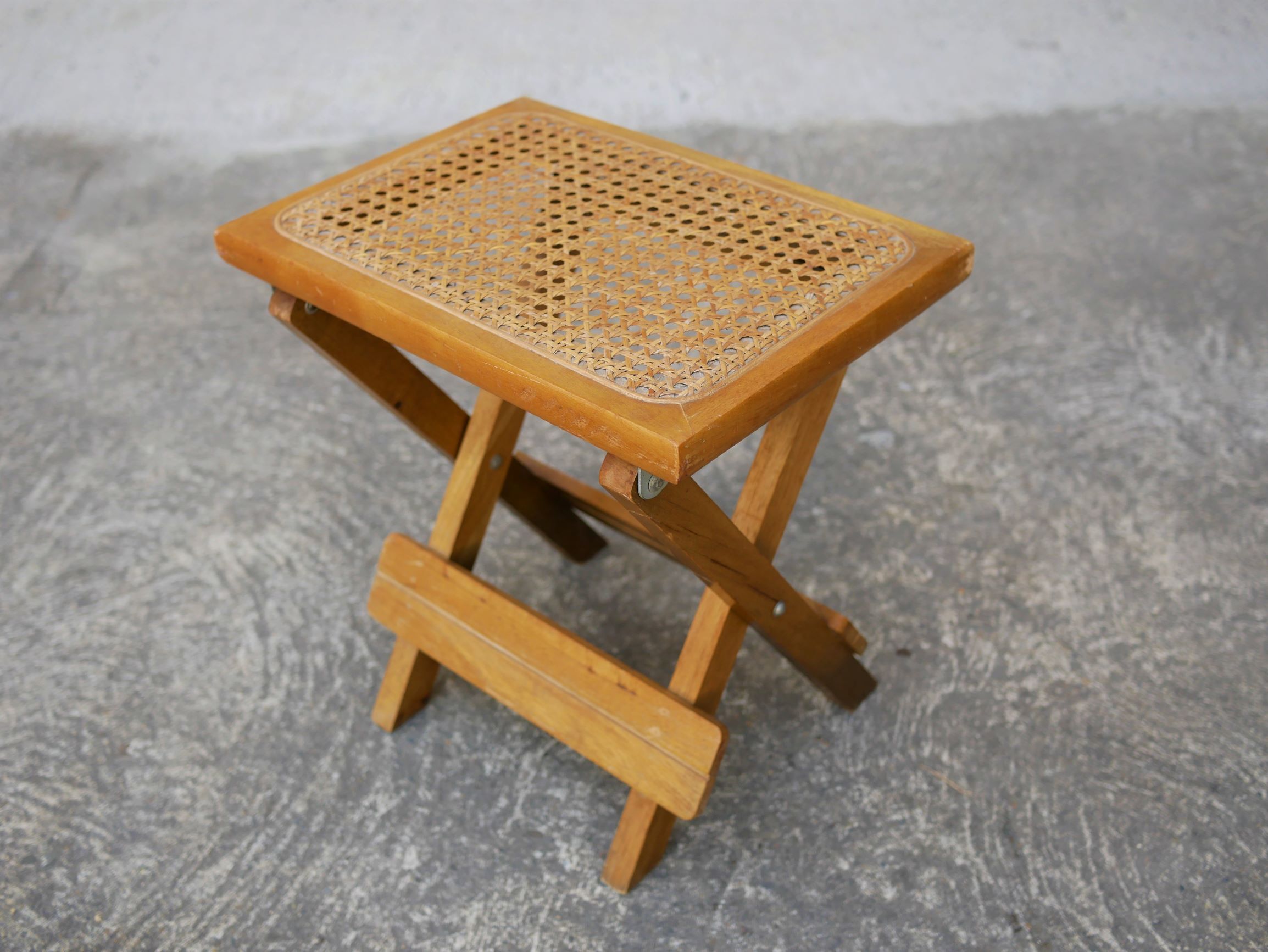 Wooden stool and folding caning