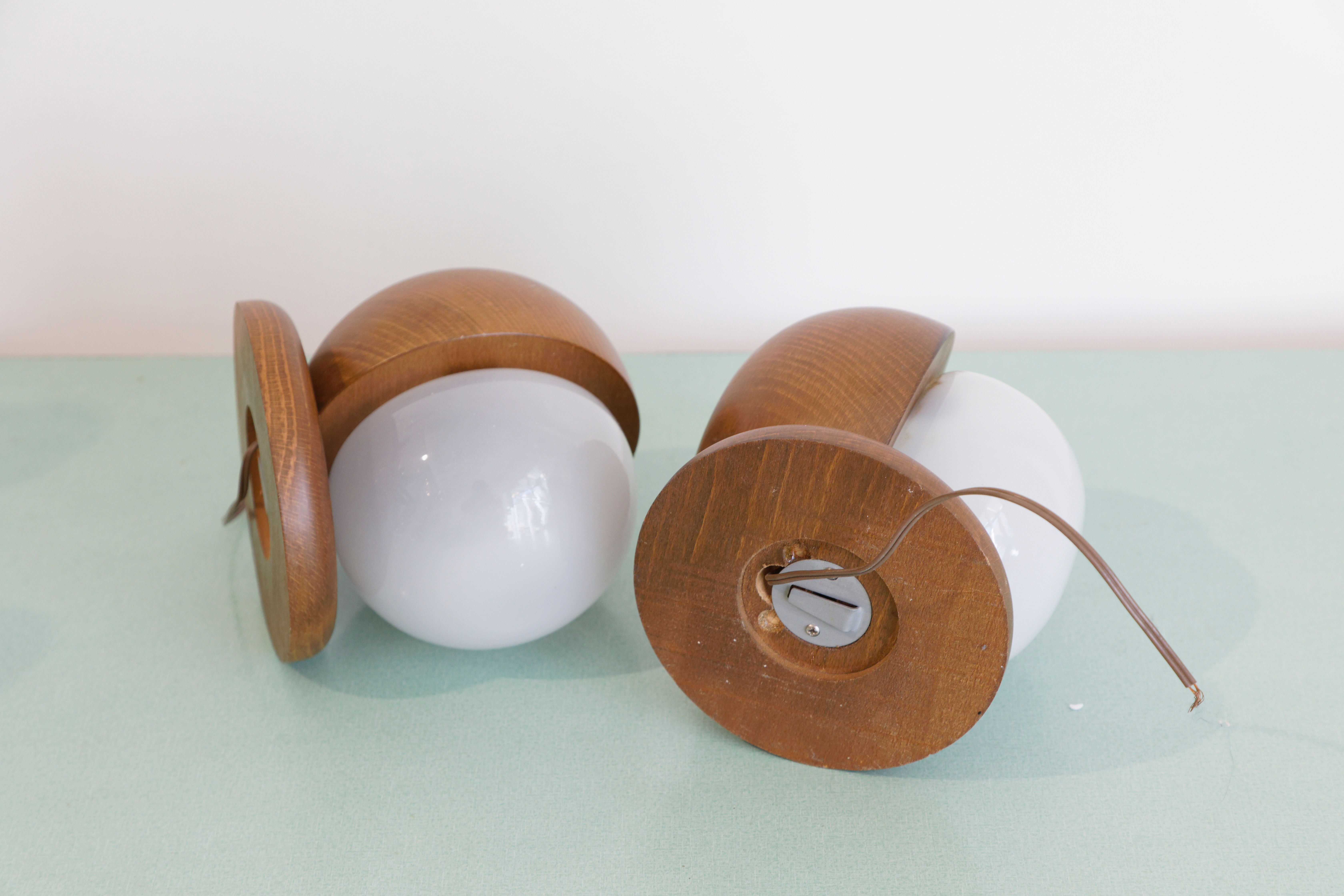 Pair of wood and opal sphere wall lamps
