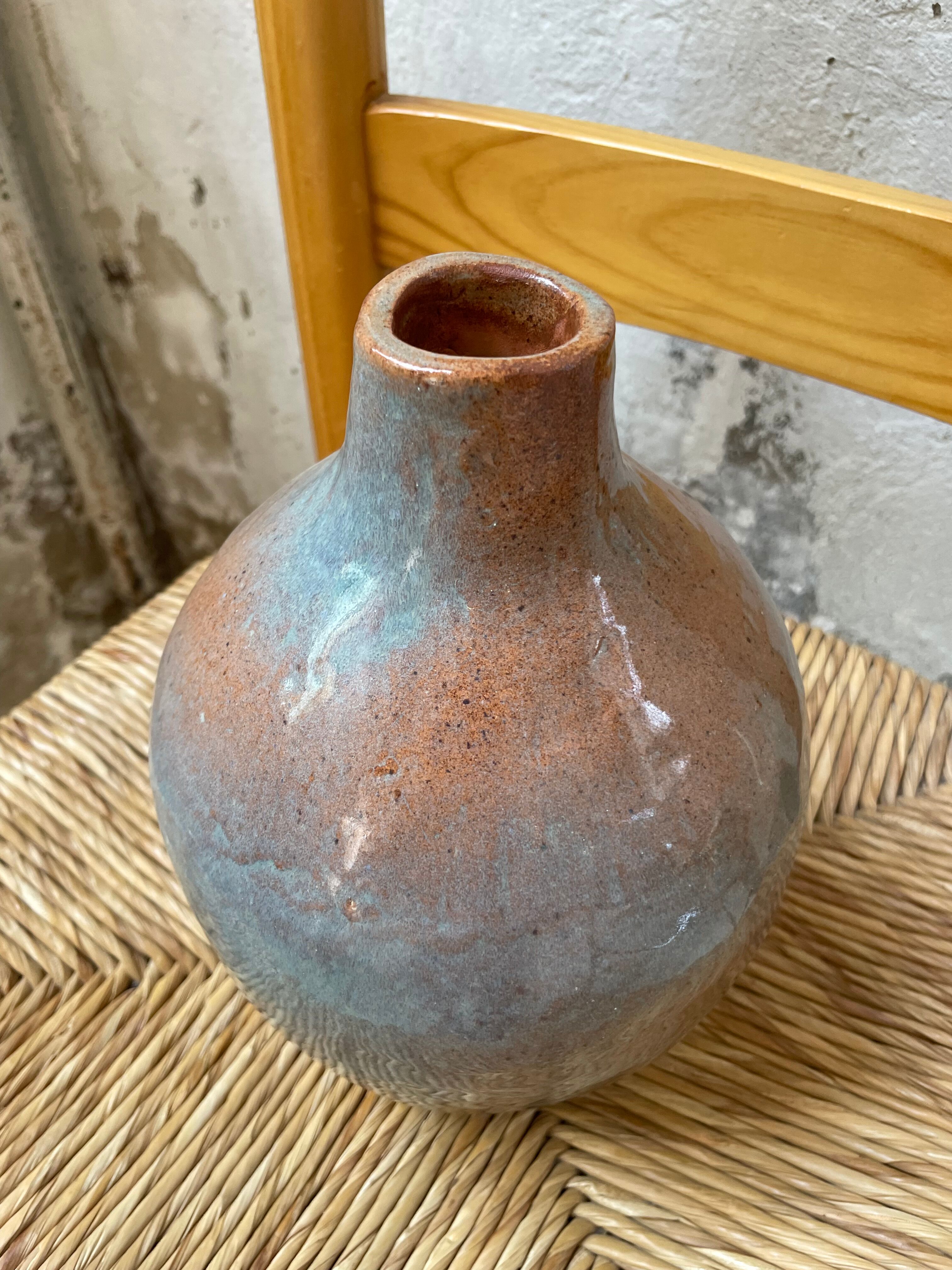 Glazed earth vase signed