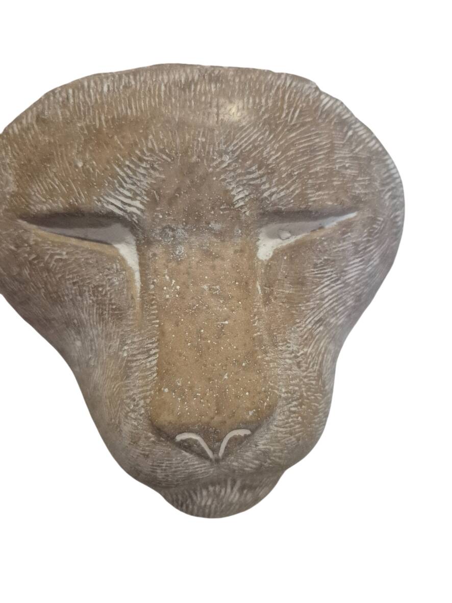 Sculpture of a lion in stone by Islay Grimes.